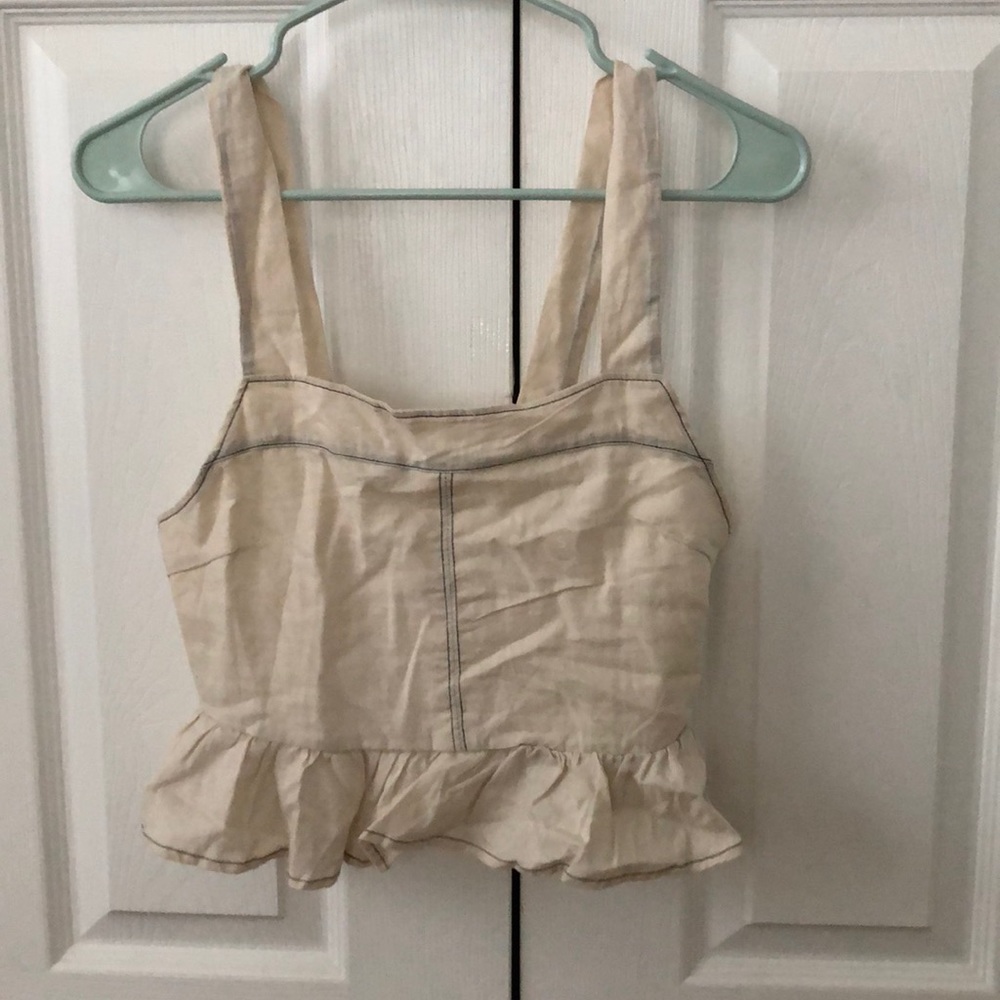 Beige tank top with navy stitching